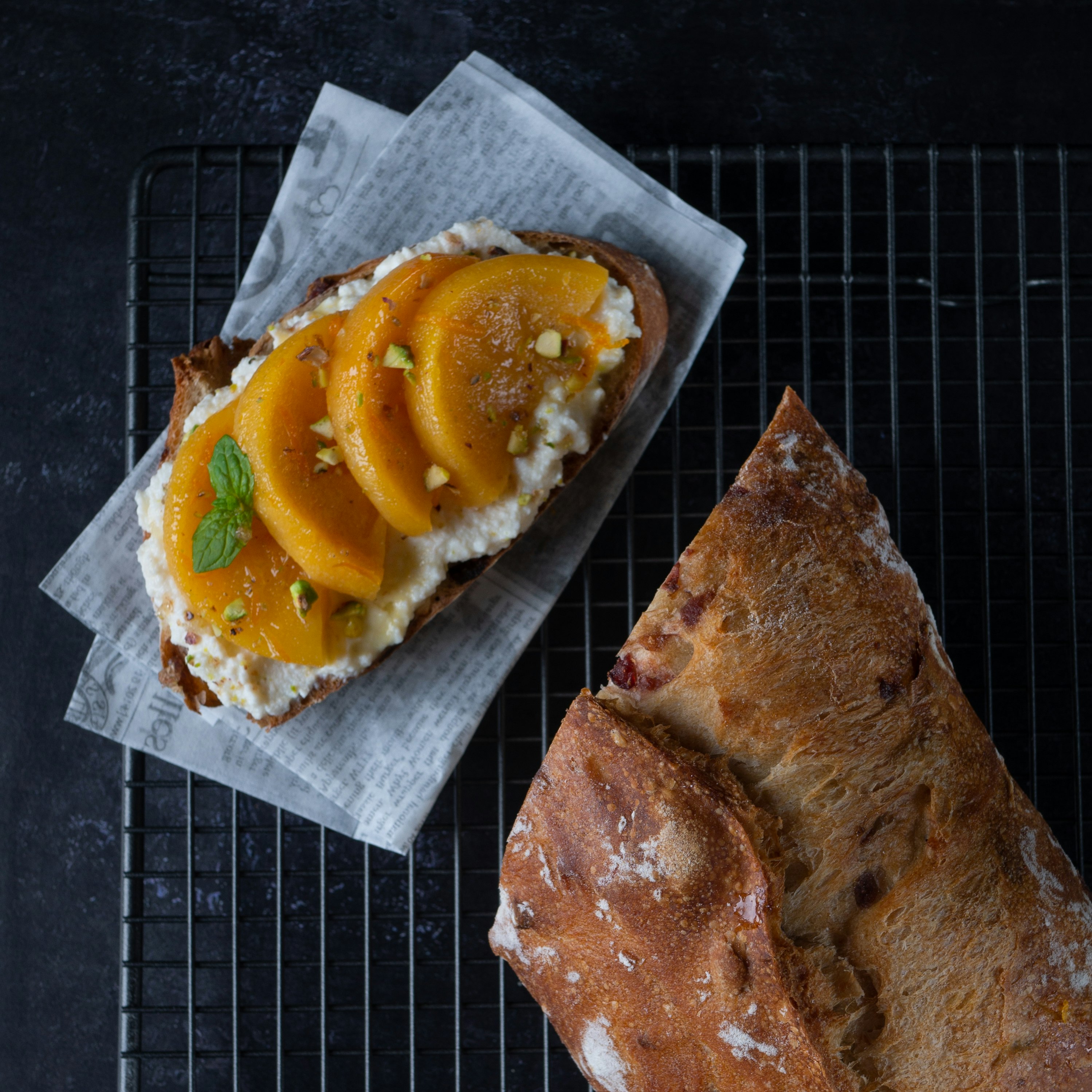 bread with sliced orange on white paper